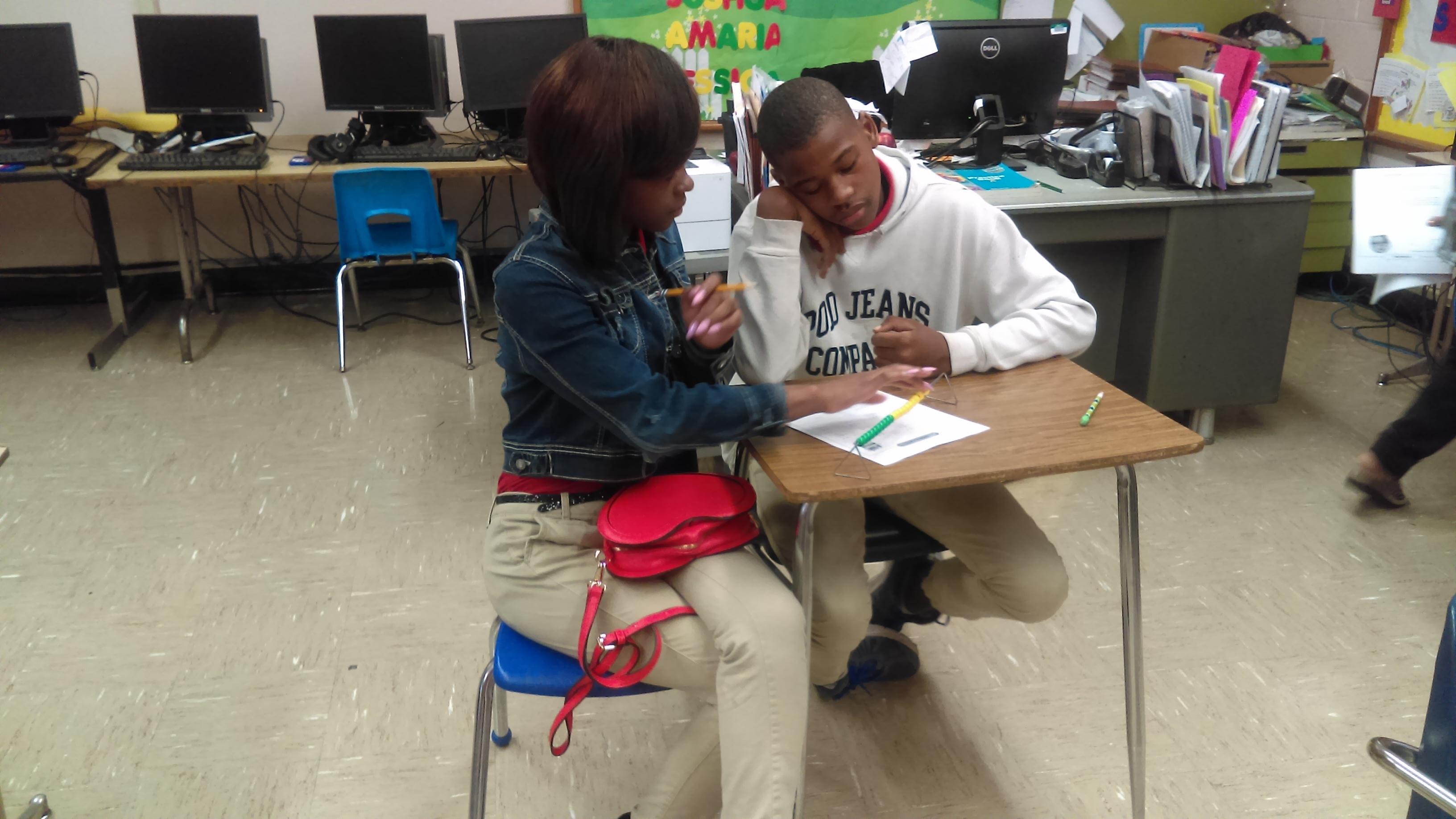 Photo of JAG Students Assisting Other Students With Math