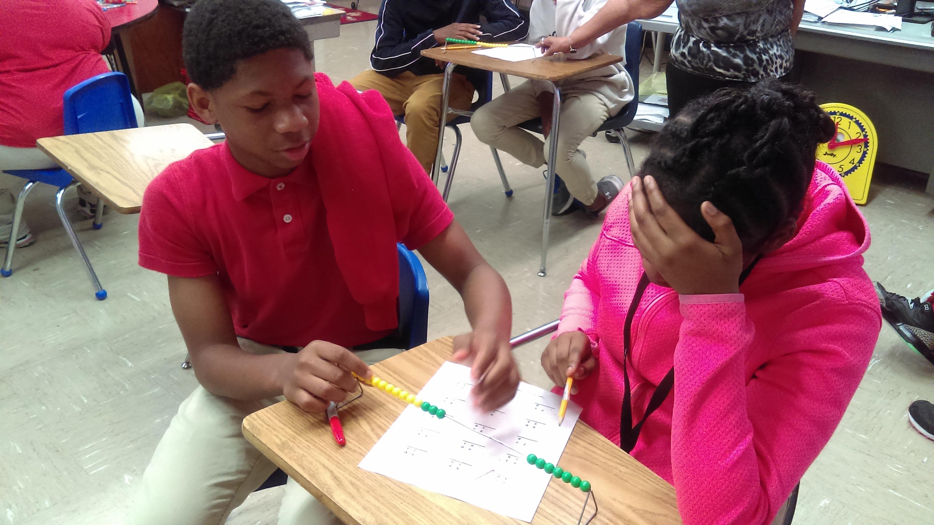 Photo of JAG Students Assisting Other Students With Math