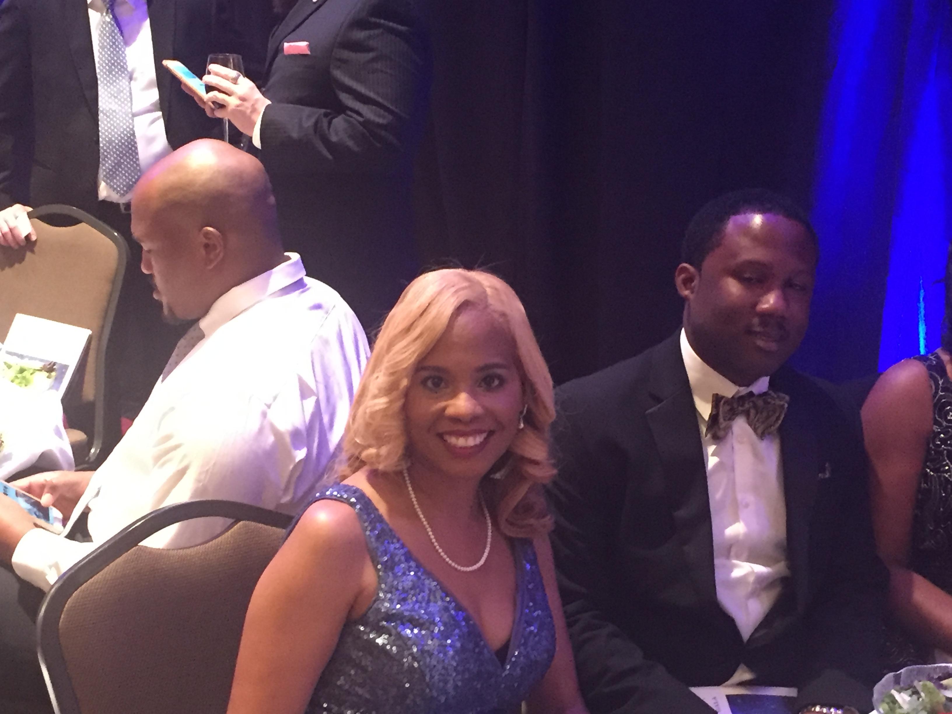 Photo of Principal Penn sitting next to her brother-in-law at the gala honoring educators from across the state