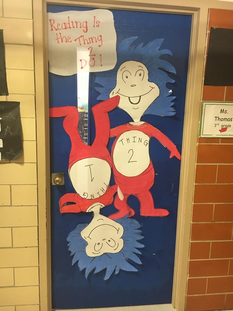 Door decorated with two red figures from whoville