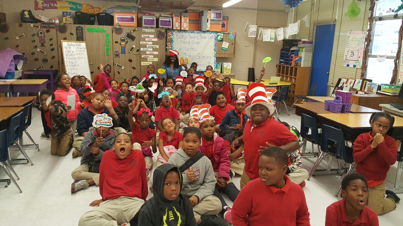 big group of children excited about reading