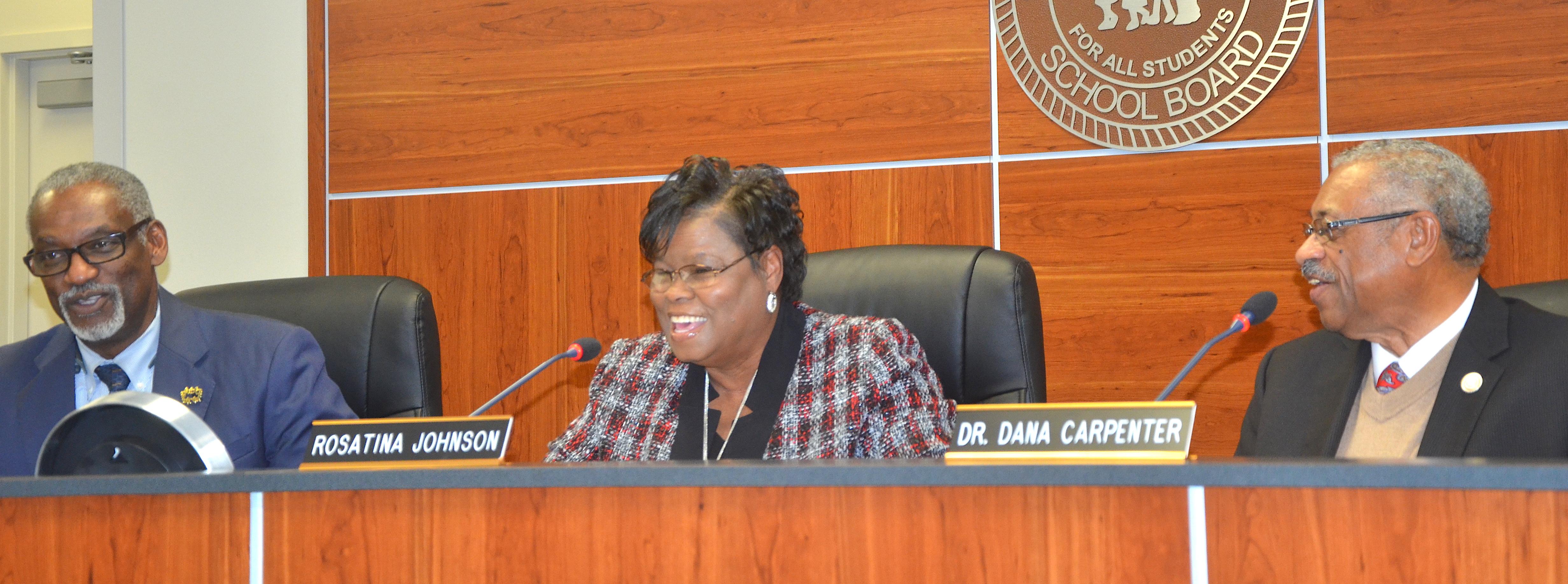 Photo of outgoing Baker school board President Rosatina  Johnson sharing a laugh with incoming Board President Dr. Dana Carpenter