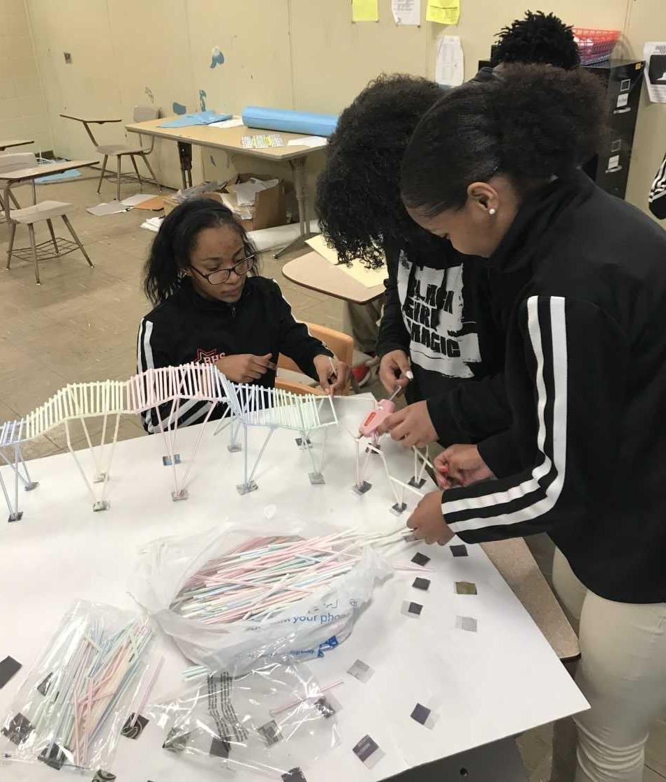 Photo of Baker High School Engineer Students Creating Roller Coasters Out Of Straws