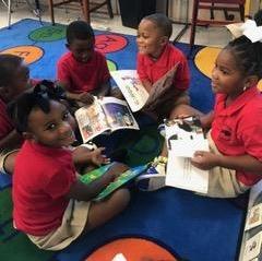 Photo of Pre-K students engaged in their own literature circles